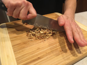 Chopping walnuts with a chef knife
