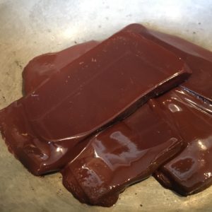 Melted organic fair trade chocolate for Paleo Pecan Bark