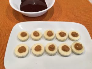 Peanut butter on sliced banana for arctic monkey bites